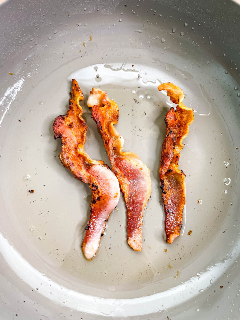 cooked bacon in a skillet