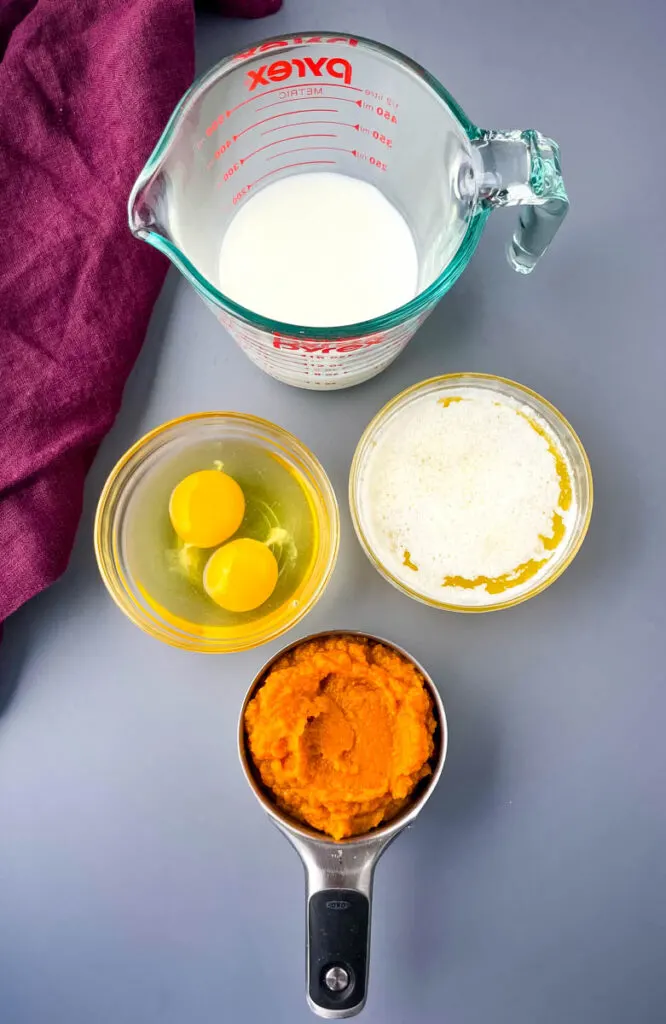 buttermilk, eggs, butter, and pure pumpkin in separate bowls