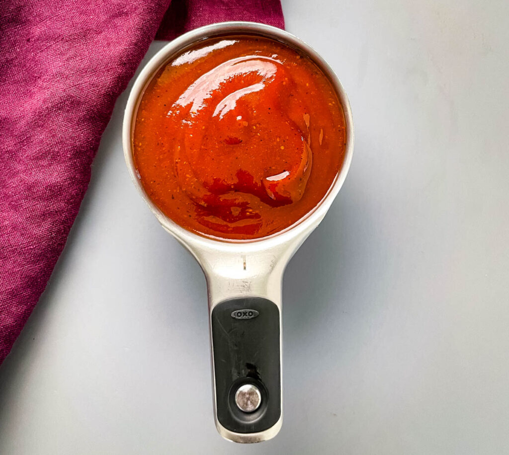 bbq sauce in a measuring cup