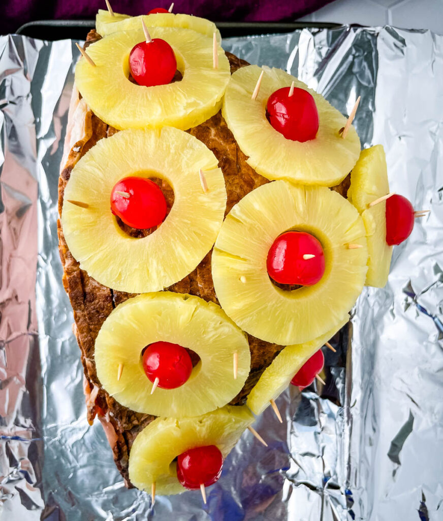 pineapple glazed ham on a sheet pan