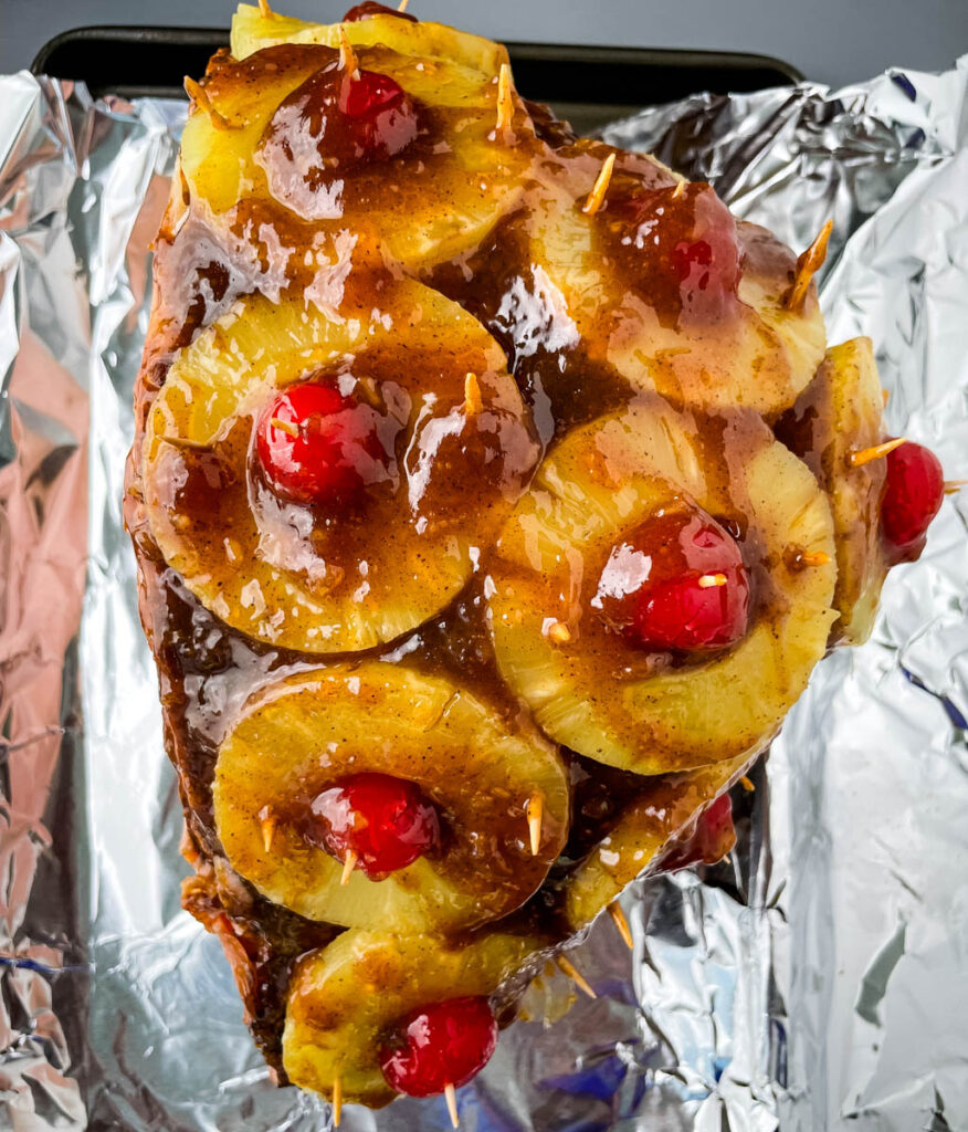 pineapple glazed ham on a sheet pan