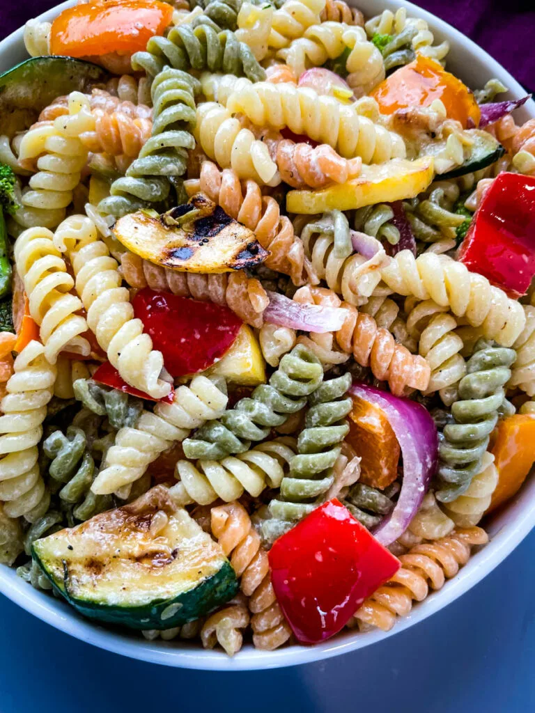 vegetable pasta salad in a white bowl