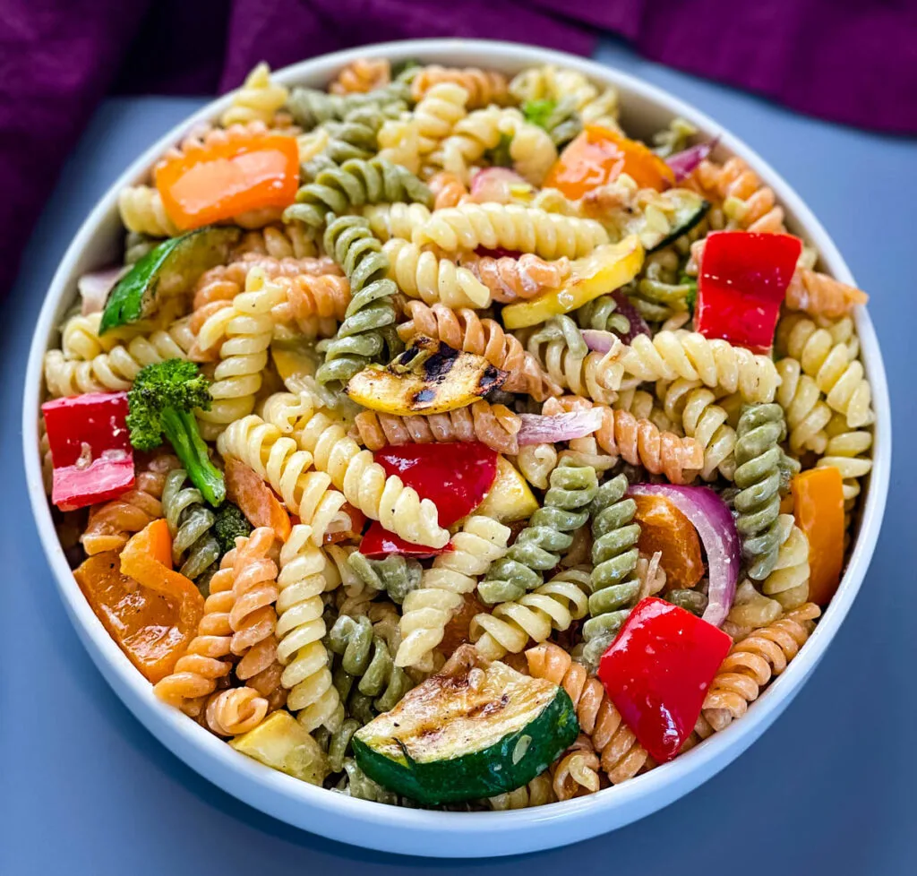 vegetable pasta salad in a white bowl