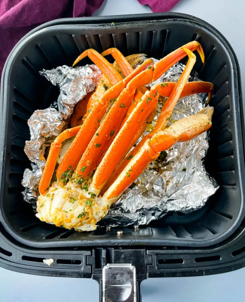 crab legs in an air fryer with foil