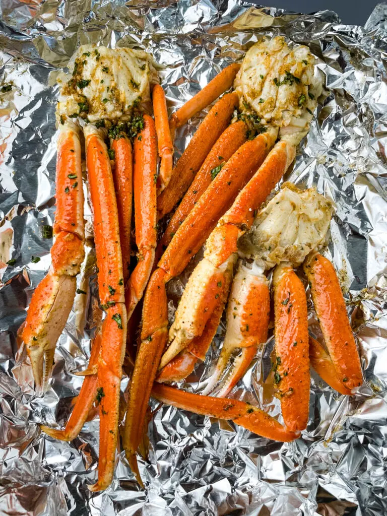 fresh crab legs on foil with garlic butter