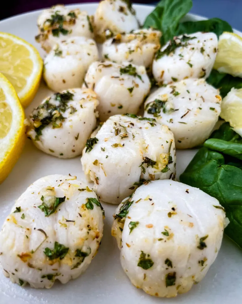 air fryer scallops on a plate with fresh lemon