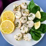air fryer scallops on a plate with fresh lemon
