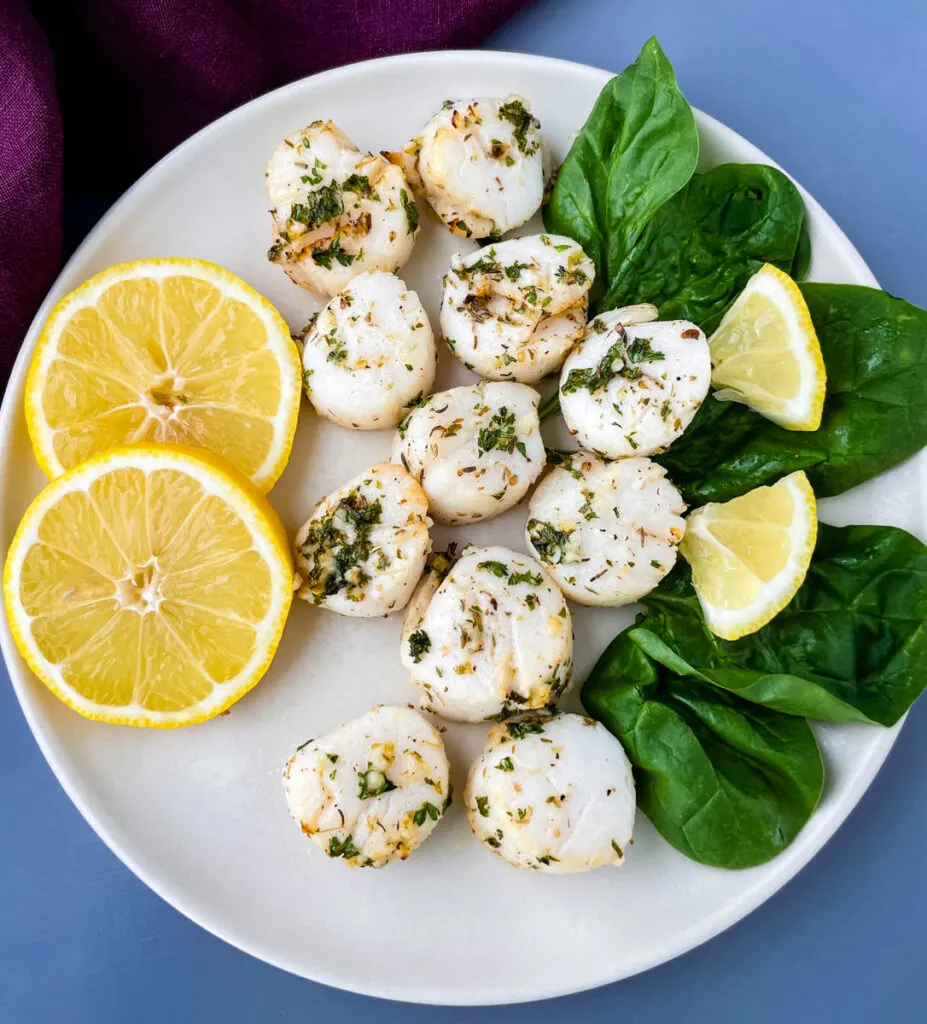 air fryer scallops on a plate with fresh lemon