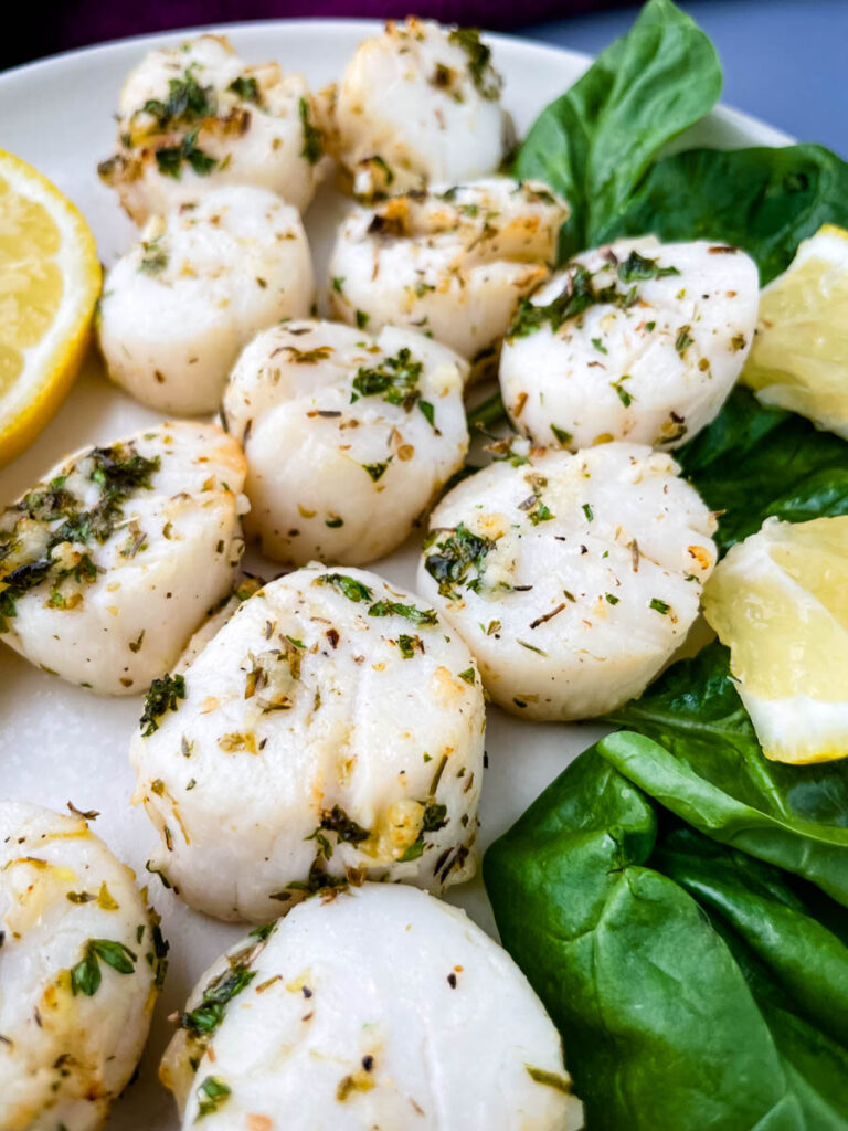 air fryer scallops on a plate with fresh lemon