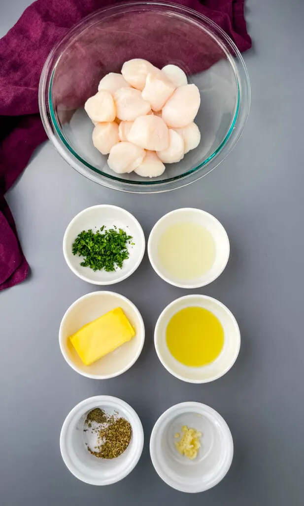 raw scallops, chopped parsley, butter, olive oil, and lemon juice in separate bowls