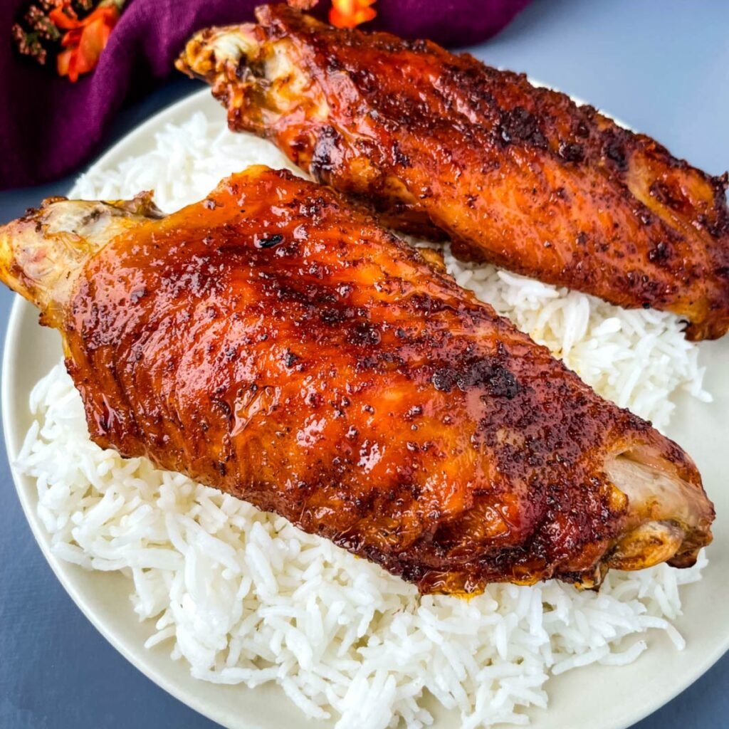 air fryer turkey wings and rice on a plate