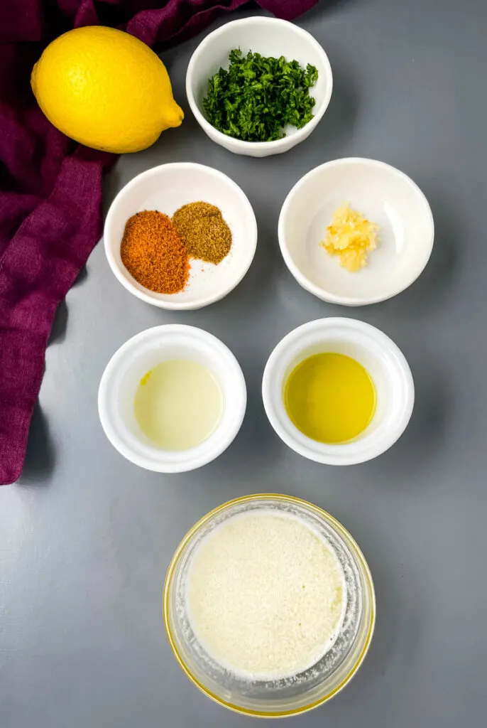 fresh lemon, fresh parsley, Cajun Seasoning, Old Bay Seasoning, minced garlic, melted butter, and olive oil in separate bowls