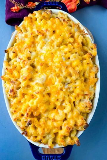 seafood shrimp and crab mac and cheese in a blue baking dish