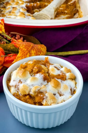 sweet potato casserole with marshmallows in a white dish