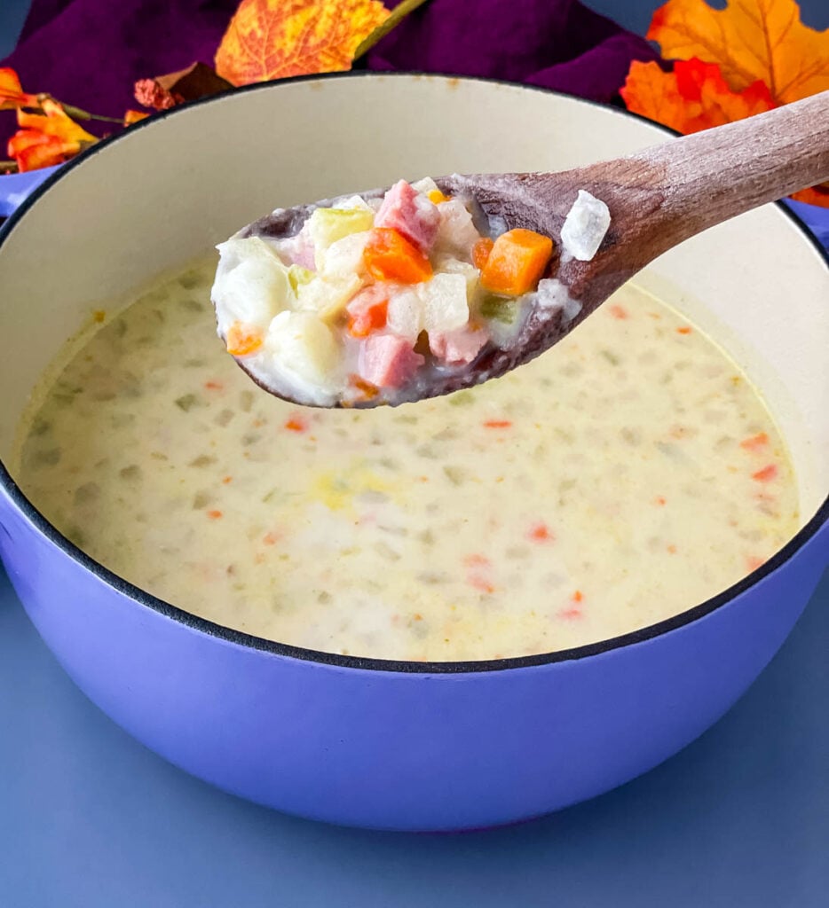 creamy ham, potato, and vegetable soup in a Dutch oven