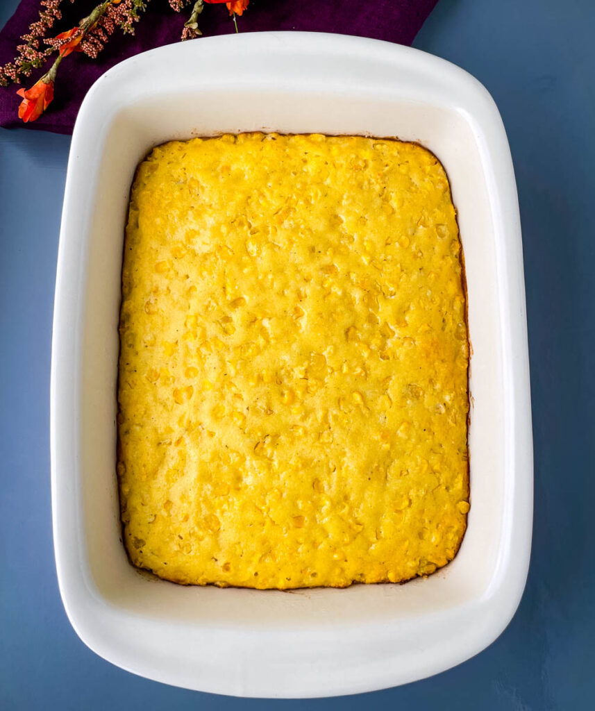 fully baked corn casserole in a baking dish