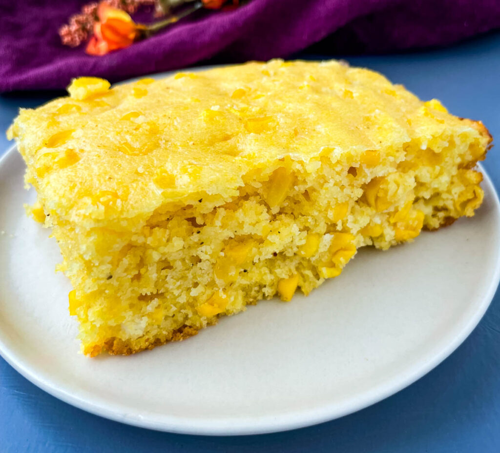 homemade cornbread casserole on a white plate