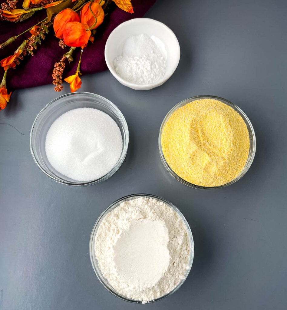 cornmeal, flour, baking powder, sweetener, and salt in separate glass bowls