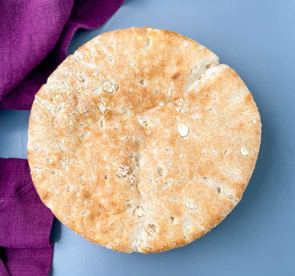 whole wheat pita bread on a flat surface