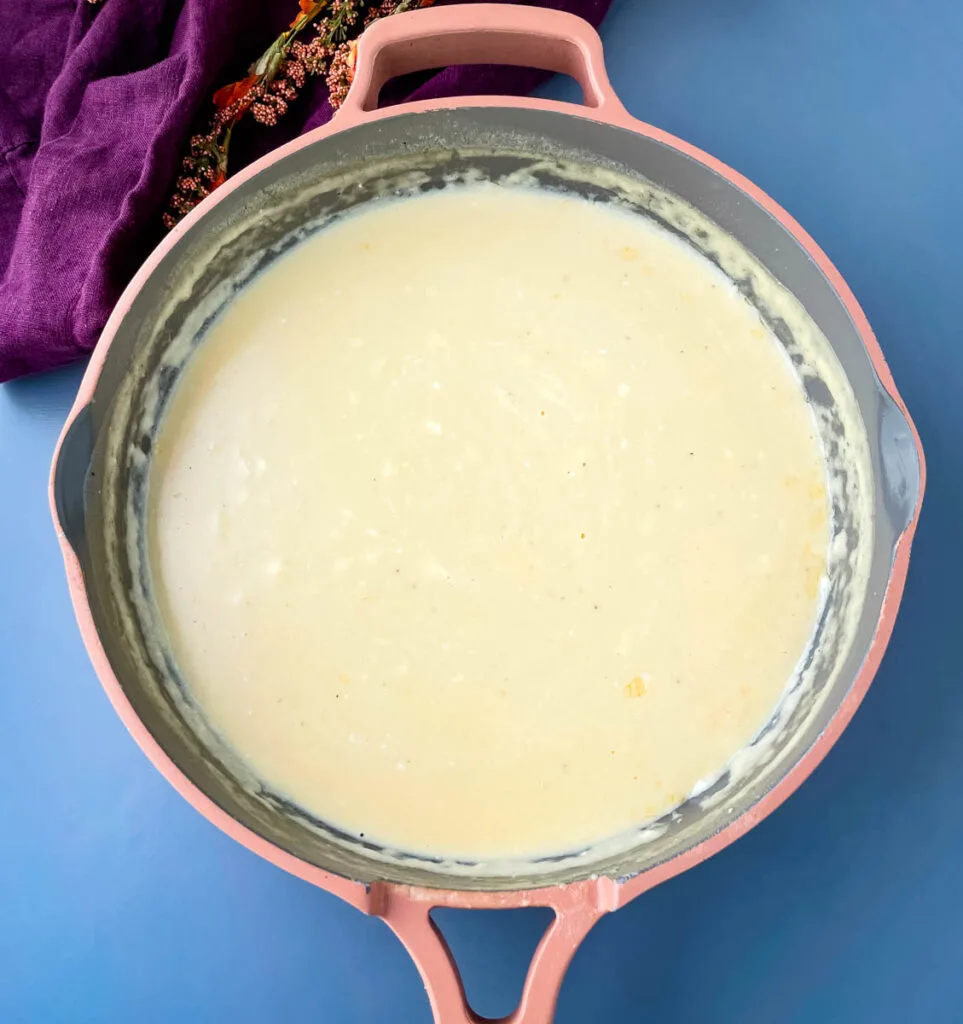 mac and cheese cream sauce in a skillet