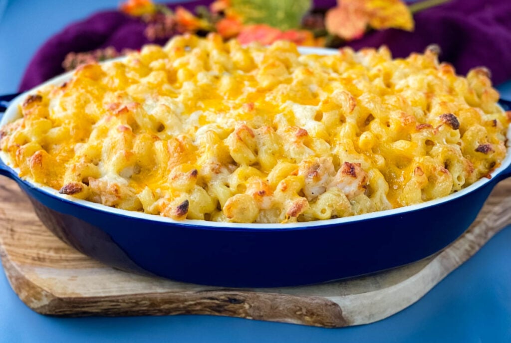 seafood shrimp and crab mac and cheese in a blue baking dish