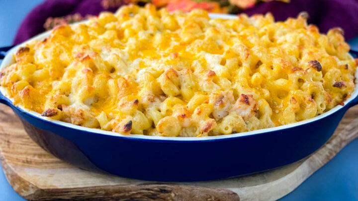 seafood shrimp and crab mac and cheese in a blue baking dish