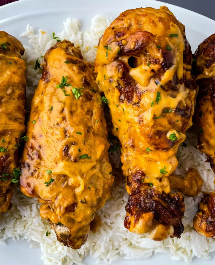 smothered turkey wings and gravy on a plate with white rice