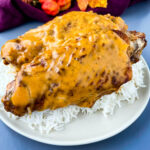 smothered turkey wings and gravy on a plate with white rice