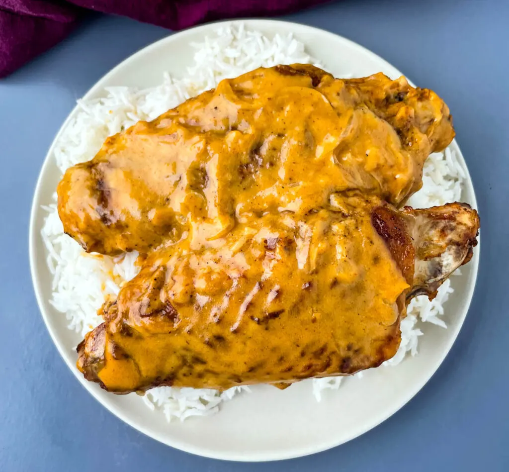 smothered turkey wings and gravy on a plate with white rice