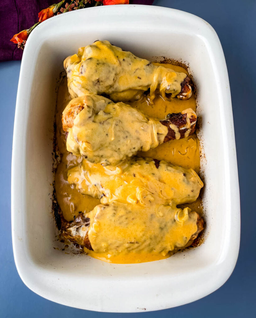 turkey wings smothered in gravy in a baking pan