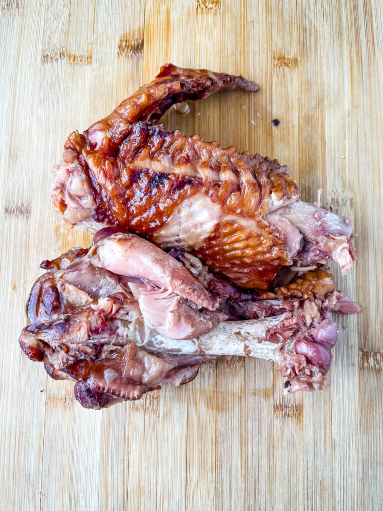 smoked turkey on a bamboo cutting board