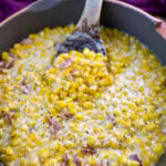 southern creamed corn in a spoon and skillet