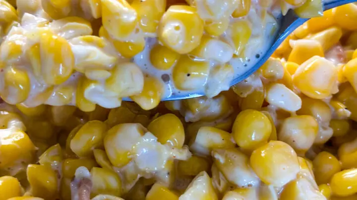 southern creamed corn in a spoon and skillet