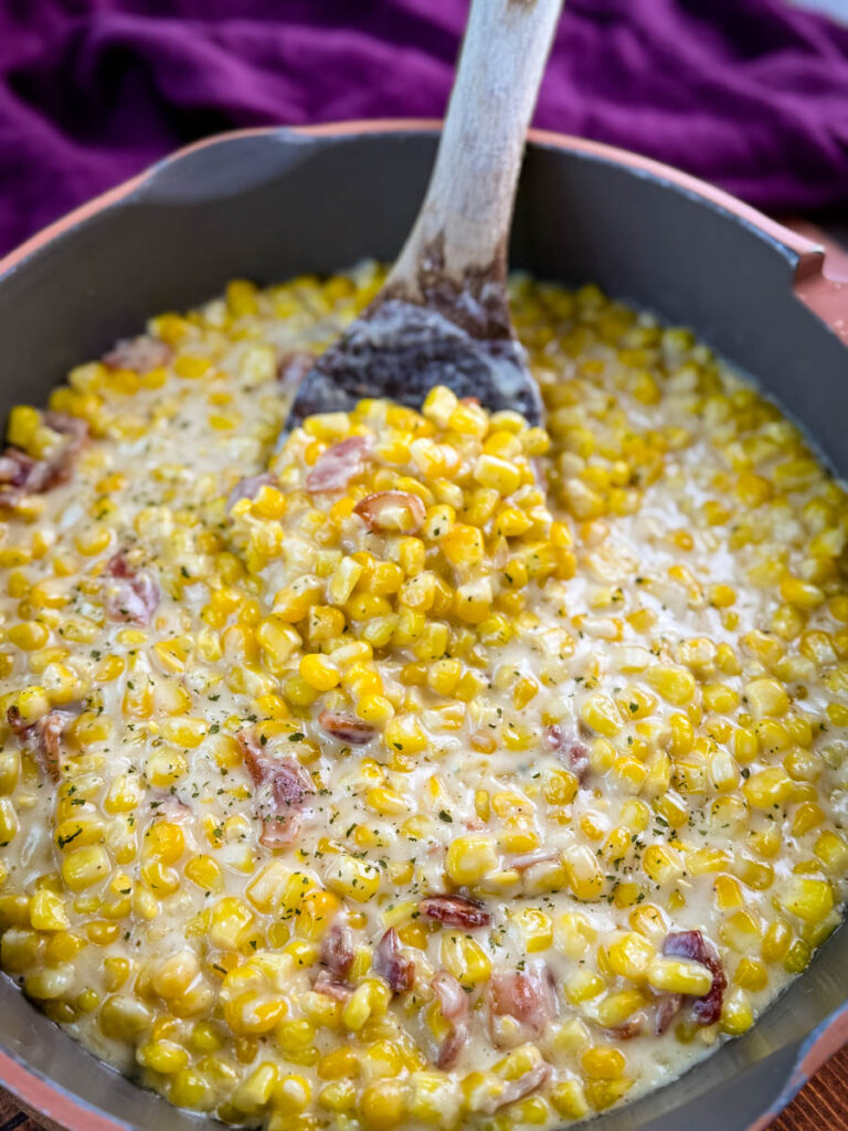 southern creamed corn in a spoon and skillet