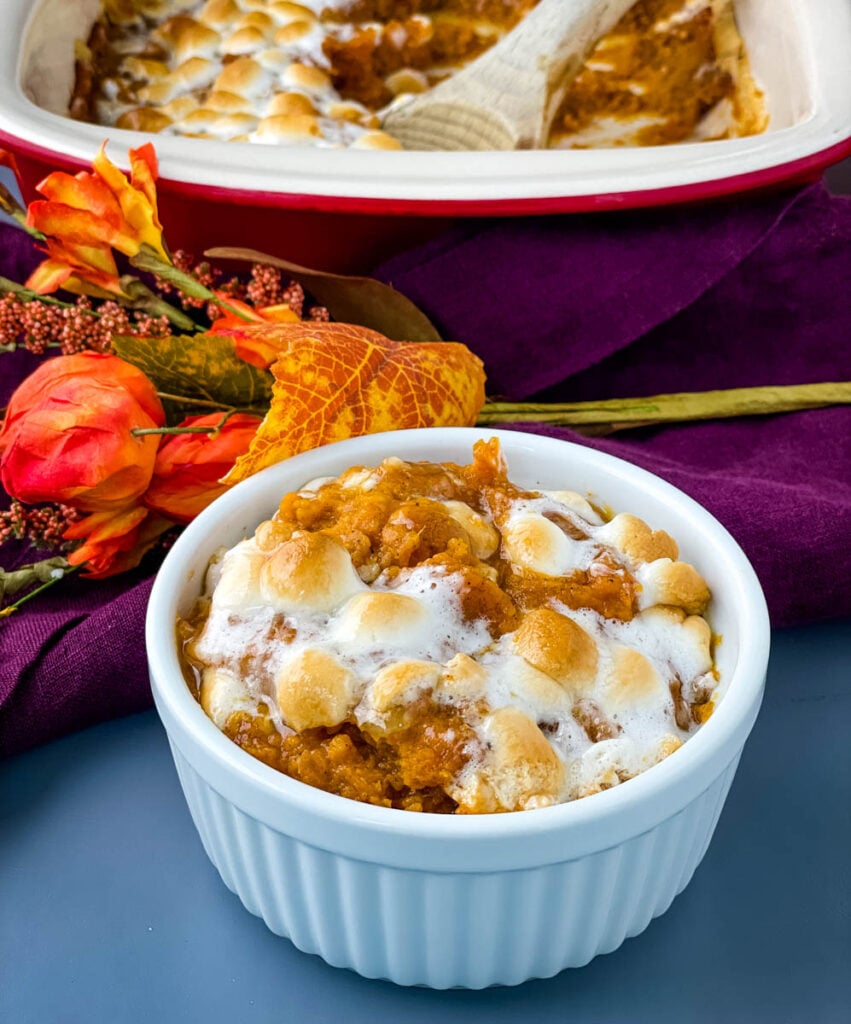 sweet potato casserole with marshmallows in a white dish