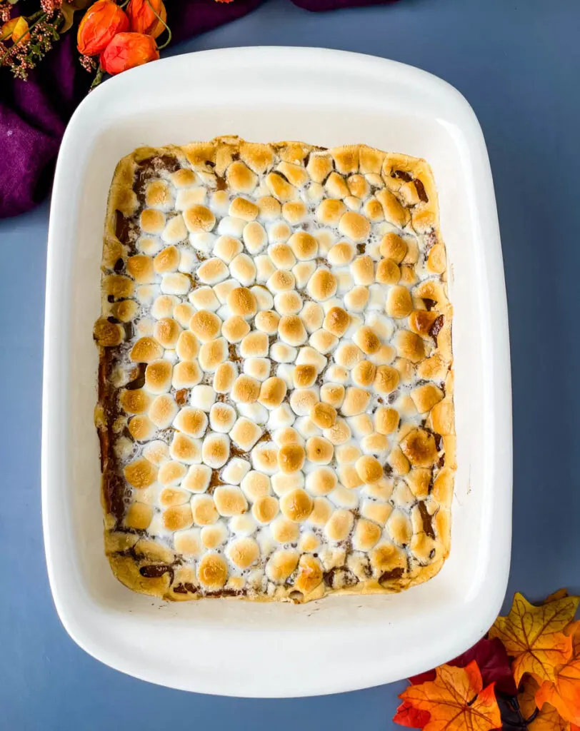 sweet potato casserole with marshmallows in a red baking dish