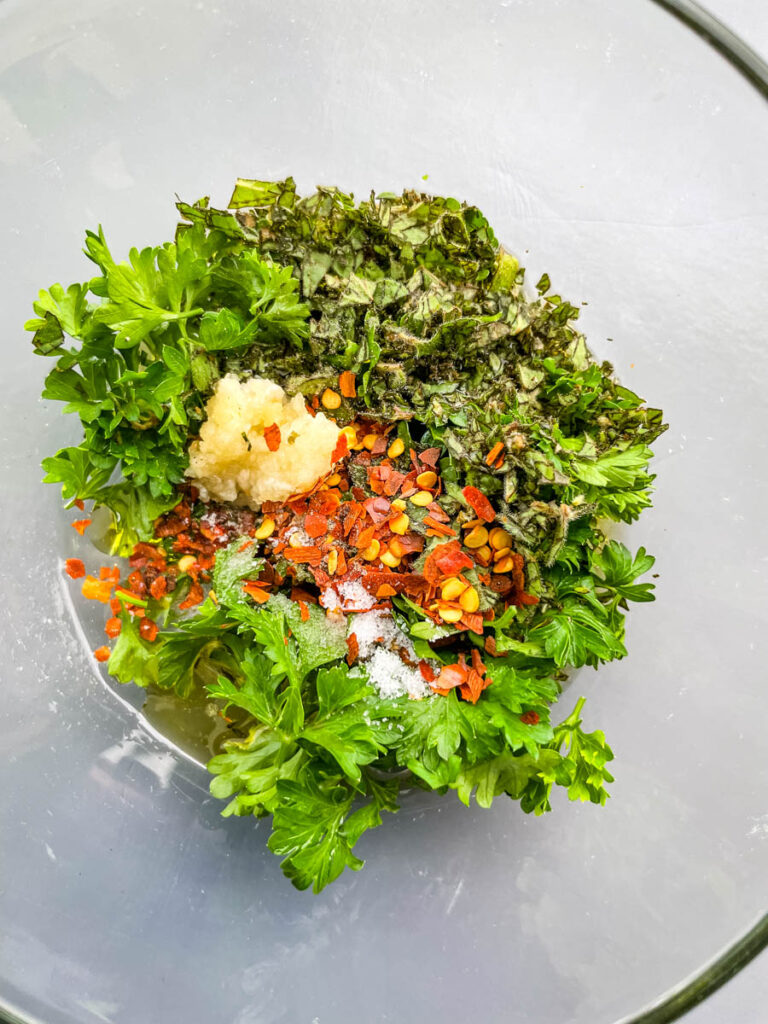 herbs and spices in a glass bowl