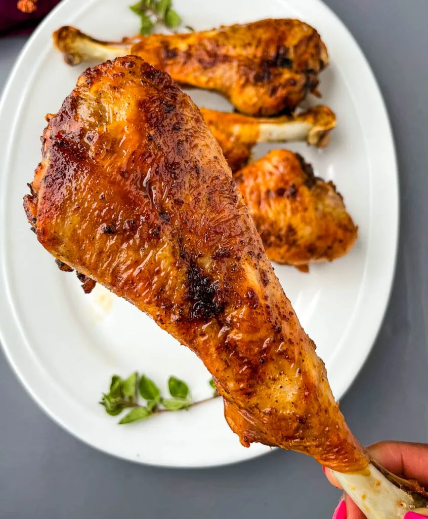 person holding an air fryer turkey leg