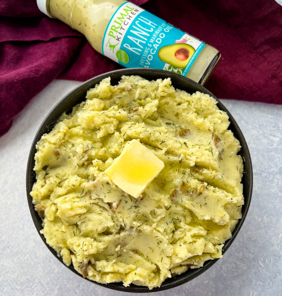 ranch mashed potatoes in a bowl with butter