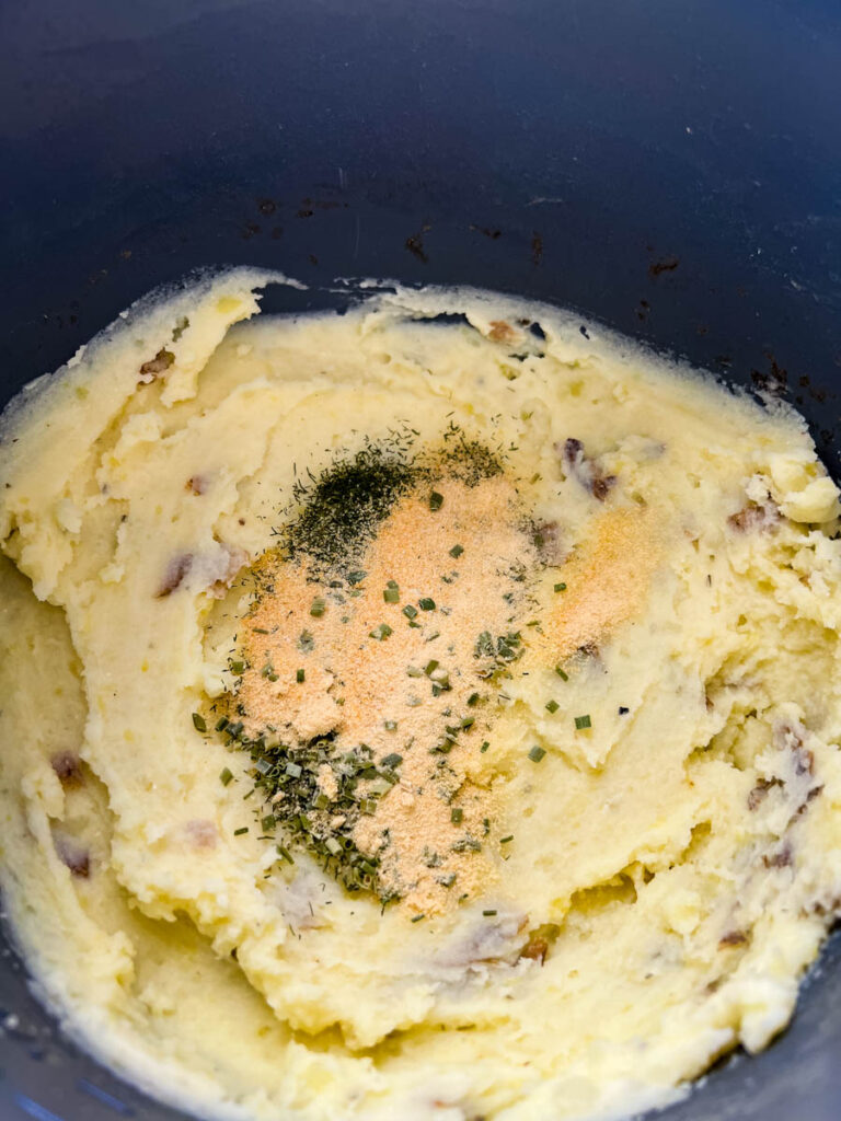 ranch mashed potatoes in a pot with spices and seasoning