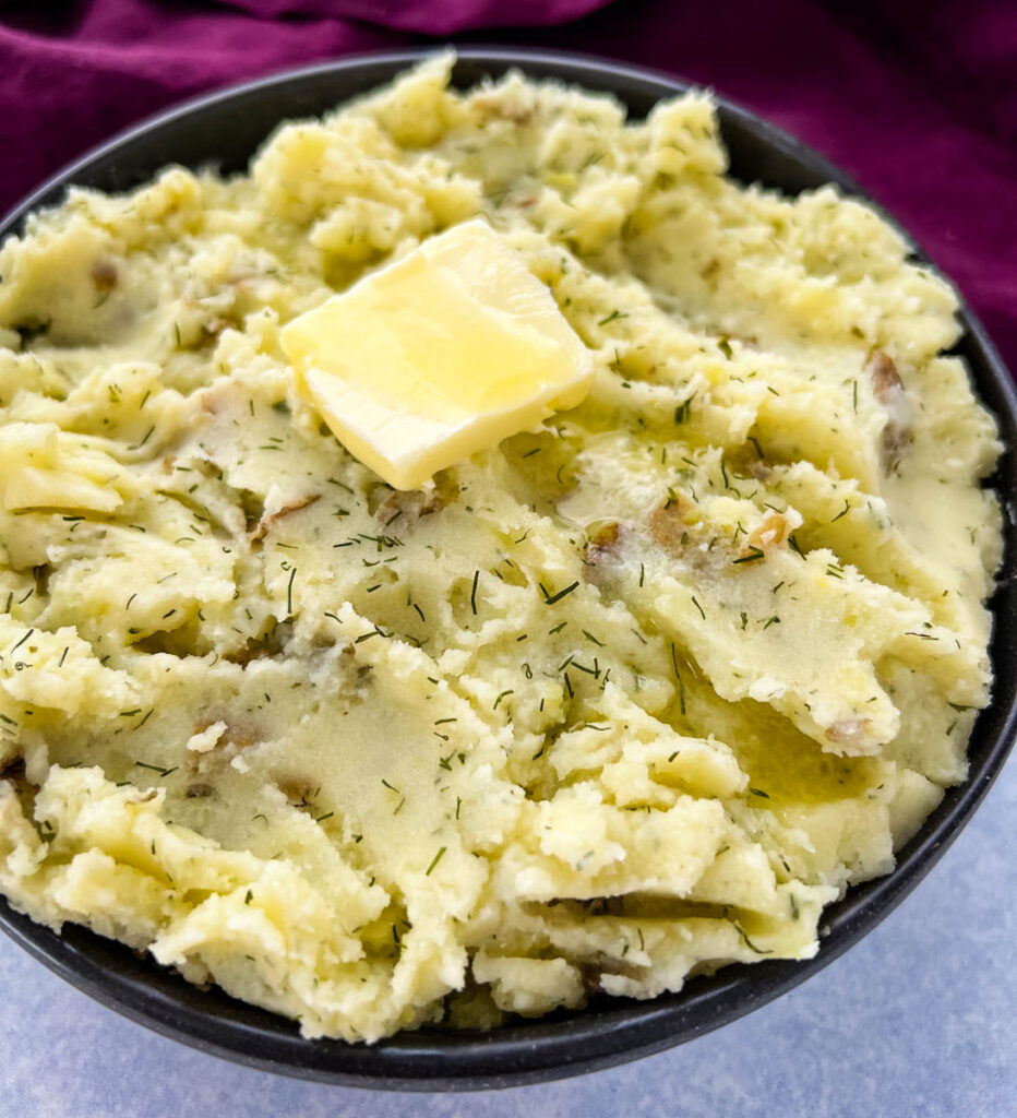 ranch mashed potatoes in a bowl with butter