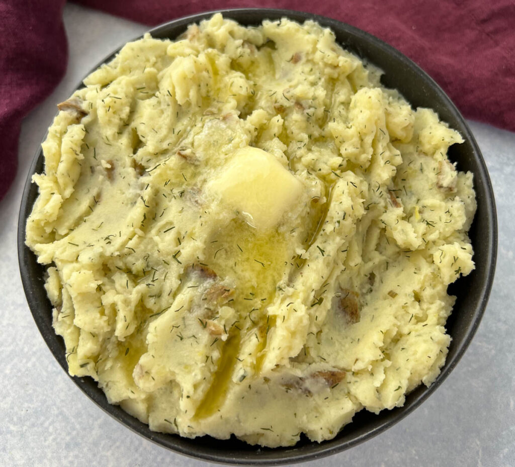 ranch mashed potatoes in a bowl with butter