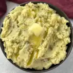 ranch mashed potatoes in a bowl with butter