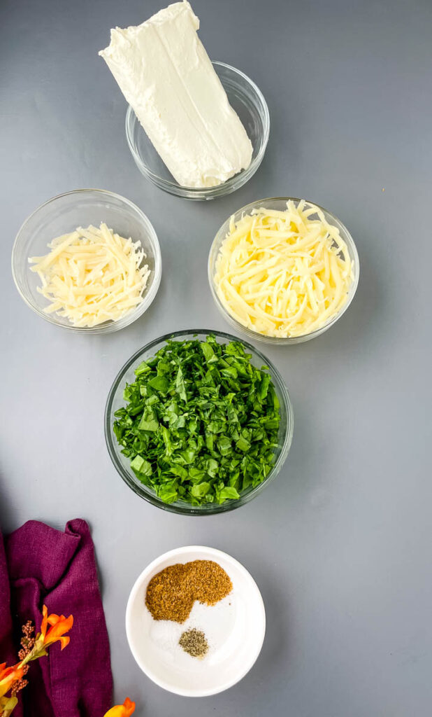 cream cheese, parmesan cheese, mozzarella, spinach, and Italian seasoning in separate bowls