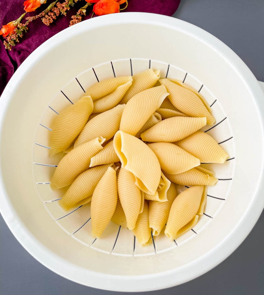 cooked pasta shells in a coriander