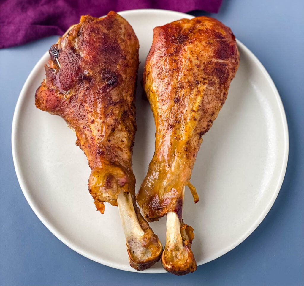 two slow cooker crockpot turkey legs on a plate