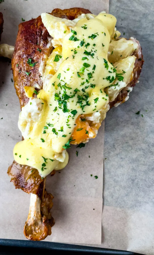 stuffed turkey leg with mac and cheese and parsley