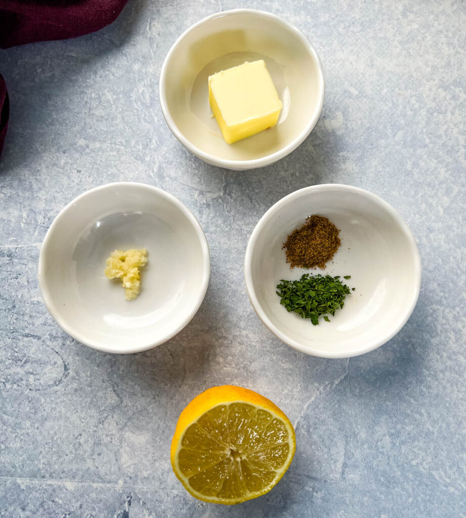 butter, garlic, parsley, lemon, and Old Bay Seasoning in separate bowls