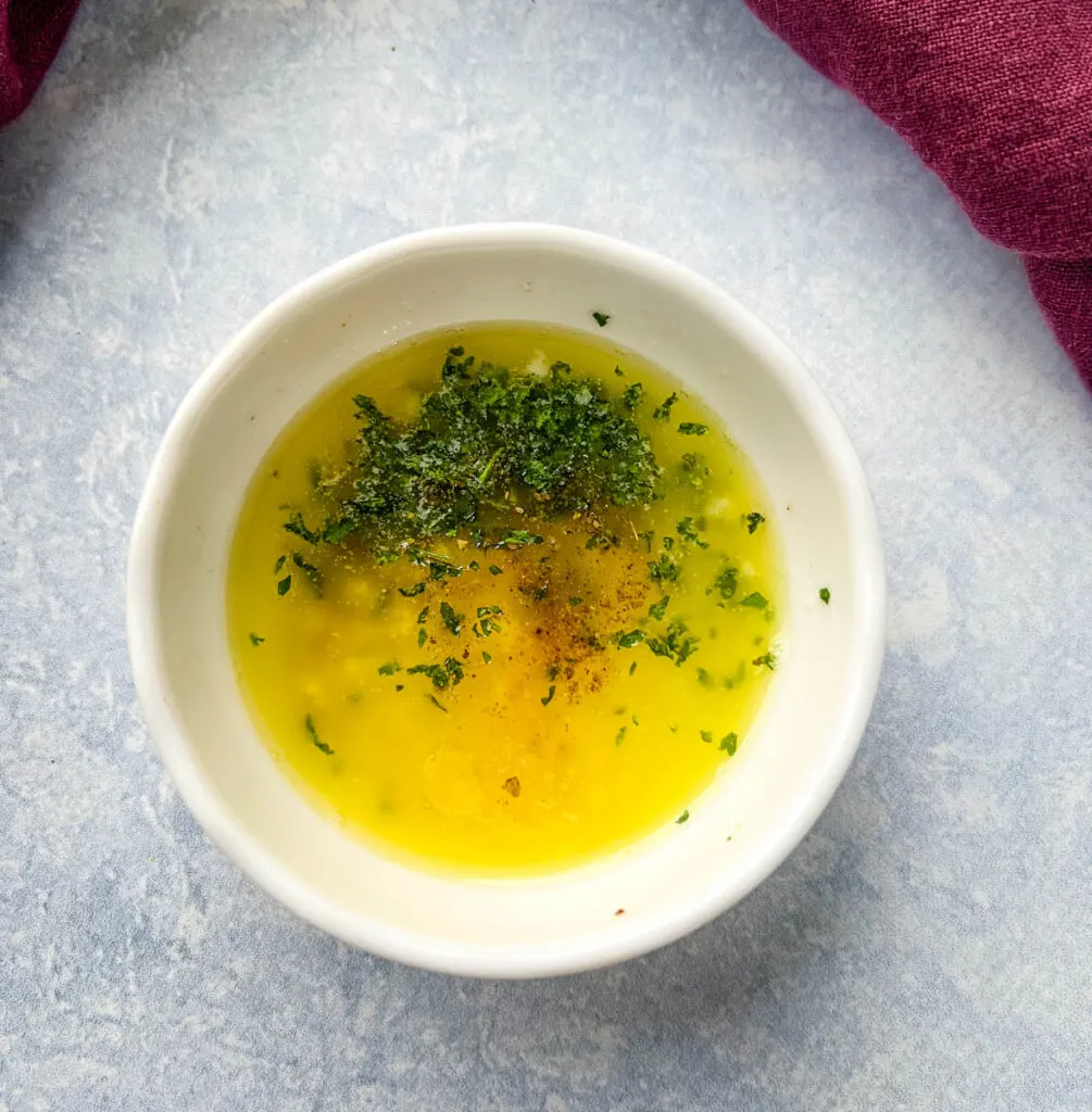 lemon garlic butter sauce in a white bowl