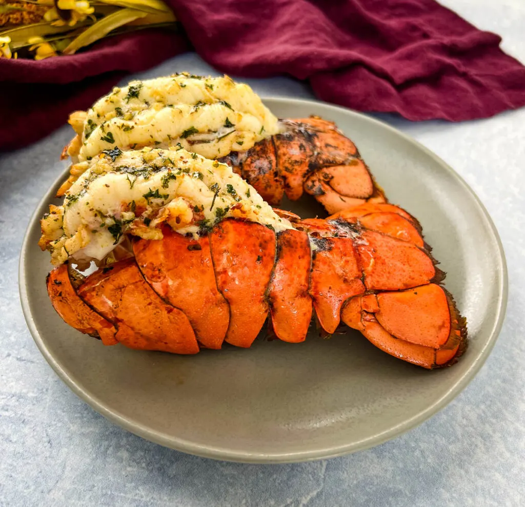 air fryer lobster tails on a white plate